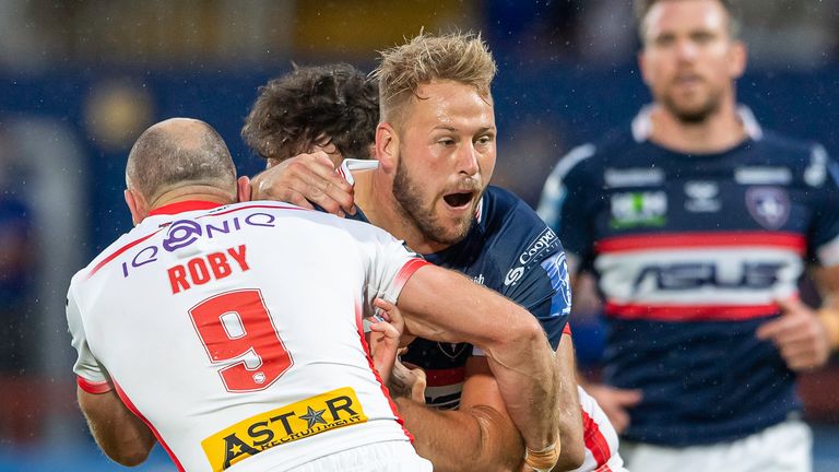 Wakefield's Joe Westerman is tackled by St Helens' James Roby and Alex Walmsley