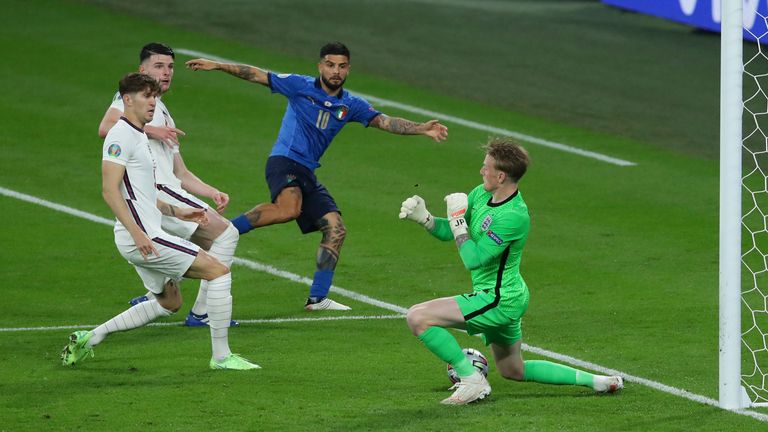 Jordan Pickford of England makes a save from Lorenzo Insigne of Italy during the UEFA Euro 2020 final at Wembley