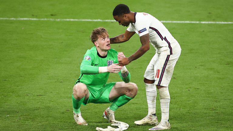 Raheem Sterling consoles Pickford during the final