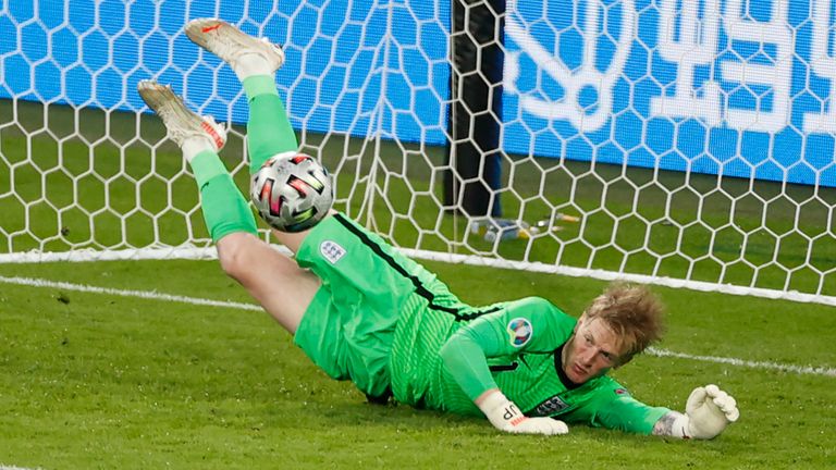 England's goalkeeper Jordan Pickford makes a save against Italy