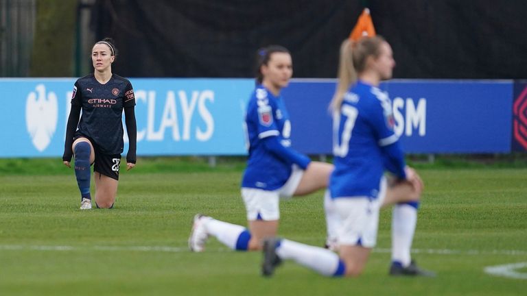 Players take the knee before the FA WSL soccer match between Everton Ladies and Manchester City Women at Walton Hall Park Stadium, Liverpool, England, Sunday Dec. 6, 2020.