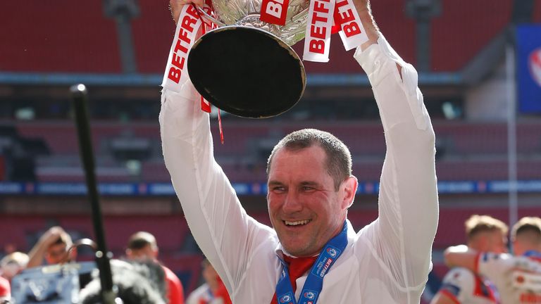 St Helens head coach Kristian Woolf lifts the Challenge Cup