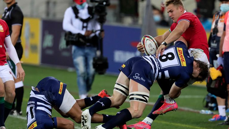 Duhan van Der Merwe of the British & Irish Lions is tackled by Evan Roos of the DHL Stormers during a rugby match between the DHL Stormers and British and Irish Lions at Cape Town Stadium in Cape Town, South Africa, Saturday, July 17, 2021. (AP Photo/Halden Krog)