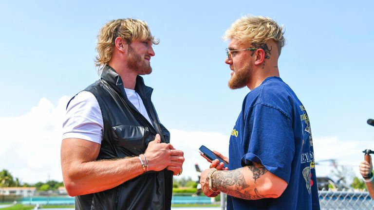 Media personality Logan Paul (left) and brother Jake Paul (right) during a media face-off event on Thursday, May 6, 2021 in Miami Gardens, Fla. (Carlos Goldman/Miami Dolphins via AP)