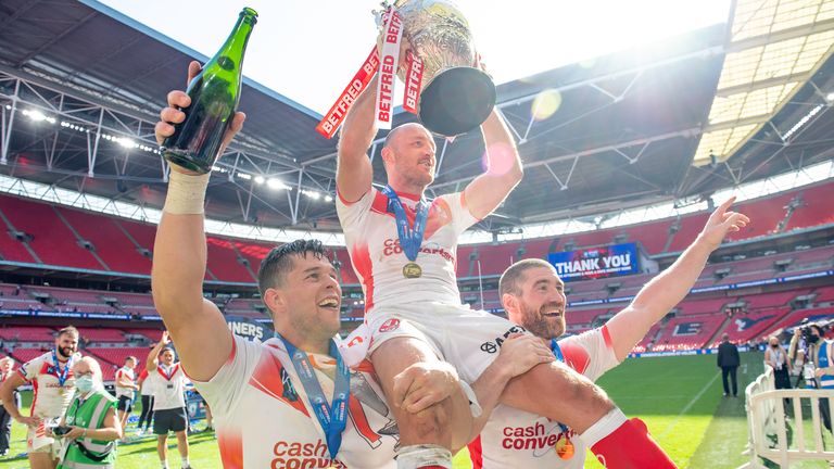 Picture by Allan McKenzie/SWpix.com - 17/07/2021 - Rugby League - Betfred Challenge Cup Final - Castleford Tigers v St Helens - Wembley Stadium, London, England - St Helens's captain James Roby is carried on the shoulders of Louie McCarthy-Scarsbrook & Kyle Amor with the Betfred Challenge Cup.