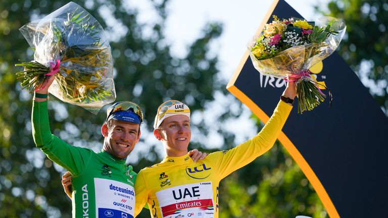 AP - Mark Cavendish (left) pictured with 2021 Tour de France winner Tadej Pogacar of Slovenia