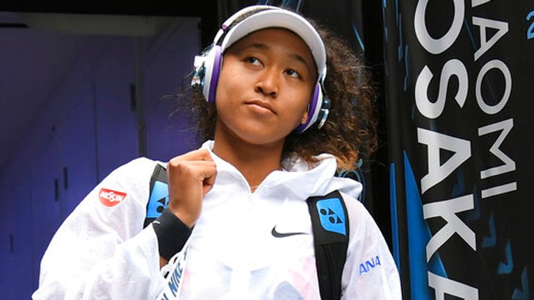 Japan&#39;s Naomi Osaka walks out onto Margaret Court Arena for her second round singles match against China&#39;s Zheng Saisai at the Australian Open tennis championship in Melbourne, Australia, Wednesday, Jan. 22, 2020. (AP Photo/Andy Brownbill)