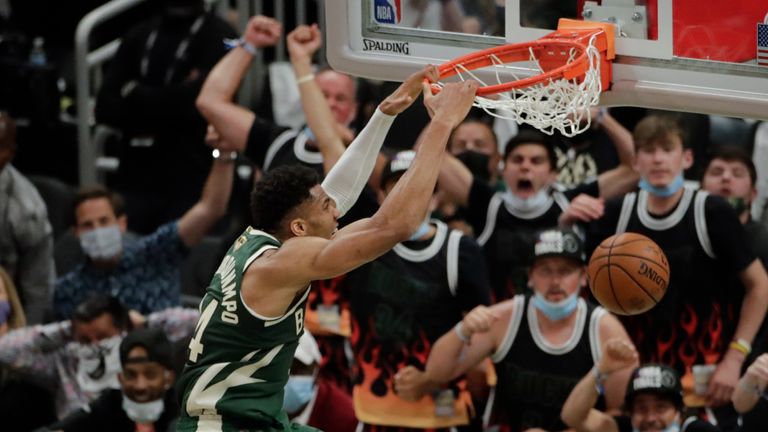 Milwaukee Bucks&#39; Giannis Antetokounmpo (34) dunks during the first half of Game 3 of basketball&#39;s NBA Finals against the Phoenix Suns, Sunday, July 11, 2021, in Milwaukee. 