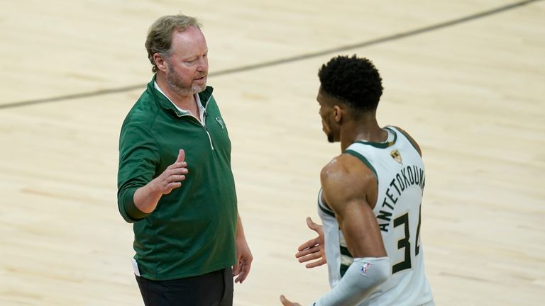 Milwaukee Bucks head coach Mike Budenholzer, left, greets forward Giannis Antetokounmpo during the second half of Game 2 of basketball's NBA Finals against the Phoenix Suns, Thursday, July 8, 2021, in Phoenix. (AP Photo/Ross D. Franklin)


