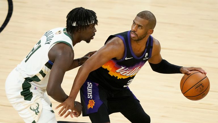 Phoenix Suns guard Chris Paul, right, is defended by Milwaukee Bucks guard Jrue Holiday during the second half of Game 2 of basketball&#39;s NBA Finals, Thursday, July 8, 2021, in Phoenix. (AP Photo/Matt York)


