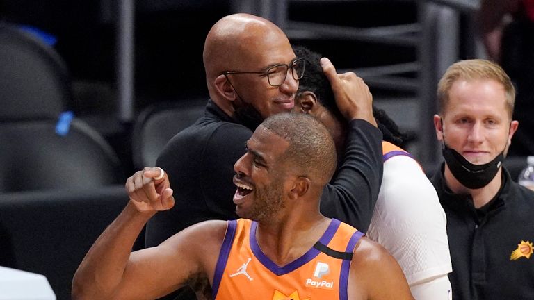 Phoenix Suns head coach Monty Williams, left, hugs Jae Crowder, second from right, while guard Chris Paul celebrates as time runs out in Game 6 of the NBA basketball Western Conference Finals against the Los Angeles Clippers Wednesday, June 30, 2021, in Los Angeles. The Suns won the game 130-103 to take the series 4-2. (AP Photo/Mark J. Terrill)


