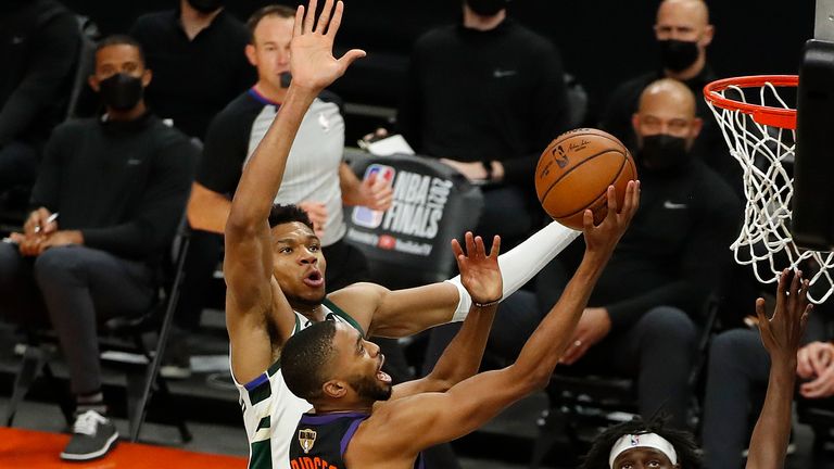 Mikal Bridges #25 of the Phoenix Suns goes up for a shot against Giannis Antetokounmpo #34 of the Milwaukee Bucks during the first half in Game One of the NBA Finals at Phoenix Suns Arena on July 06, 2021 in Phoenix, Arizona.
