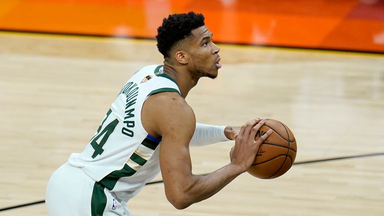 Giannis Antetokounmpo attempts a free throw against the Phoenix Suns in Game 1