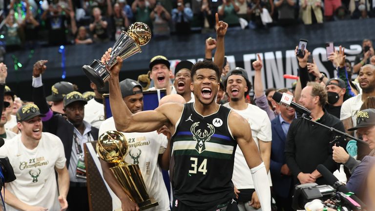 MILWAUKEE, WI - July 17: Giannis Antetokounmpo #34 of the Milwaukee Bucks celebrates winning the Bill Russell NBA Finals MVP Award after defeating the Phoenix Suns in Game Six to win the 2021 NBA Finals on July 17, 2021 at Fiserv Forum in Milwaukee, Wisconsin. NOTE TO USER: User expressly acknowledges and agrees that, by downloading and or using this photograph, user is consenting to the terms and conditions of the Getty Images License Agreement. Mandatory Copyright Notice: Copyright 2021 NBAE (Photo by Joe Murphy/NBAE via Getty Images)