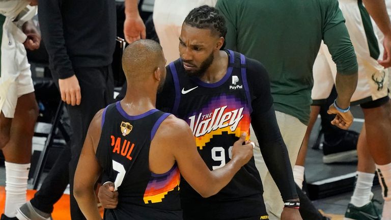 Phoenix Suns guard Chris Paul, left, celebrates with Jae Crowder after the Suns defeated the Milwaukee Bucks in Game 2 of basketball...s NBA Finals, Thursday, July 8, 2021, in Phoenix. (AP Photo/Matt York)