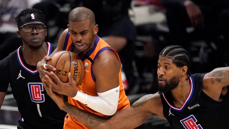 Los Angeles Clippers guard Paul George, right, reaches in on Phoenix Suns guard Chris Paul during the second half in Game 6 of the NBA basketball Western Conference Finals Wednesday, June 30, 2021, in Los Angeles. (AP Photo/Mark J. Terrill)


