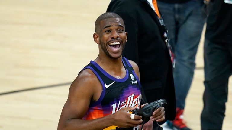 Phoenix Suns guard Chris Paul smiles at the crowd after Game 1 of basketball&#39;s NBA Finals against the Milwaukee Bucks, Tuesday, July 6, 2021, in Phoenix. The Suns defeated the Bucks 118-105.