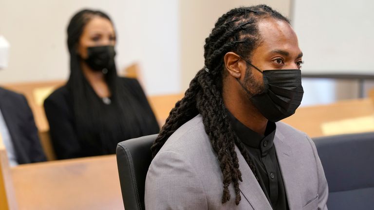 Richard Sherman, right, sits in court as his wife Ashley Sherman, left, looks on during a hearing