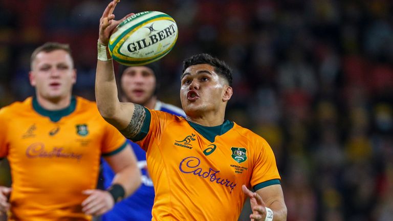 Australias' Noah Lolesio reaches up to catch the ball during the rugby international between France and Australia at Suncorp Stadium in Brisbane, Australia, Wednesday, July 7, 2021. (AP Photo/Tertius Pickard)