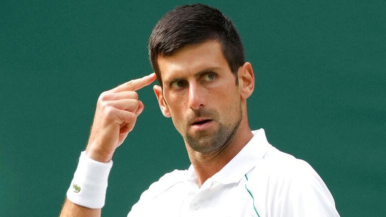 Serbia's Novak Djokovic gestures during the men's singles final match against Italy's Matteo Berrettini on day thirteen of the Wimbledon Tennis Championships in London, Sunday, July 11, 2021. (AP Photo/Alberto Pezzali)