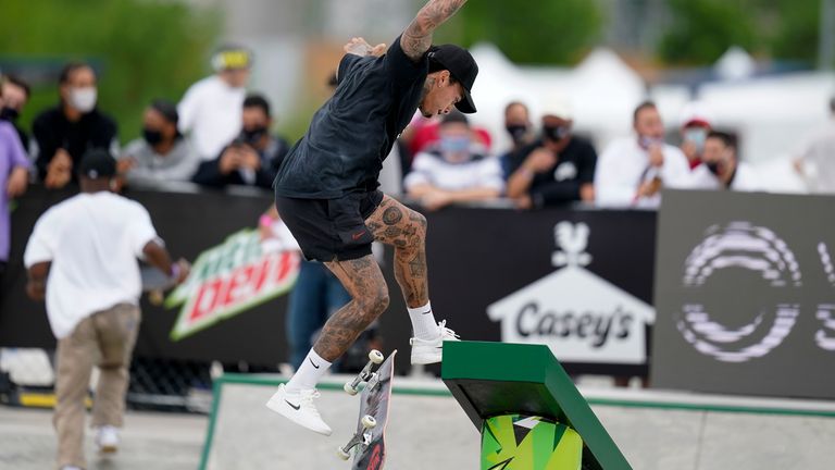 Nyjah Houston, of the United States, practices for the Olympic qualifying skateboard event at Lauridsen Skatepark, Thursday, May 20, 2021, in Des Moines, Iowa. (AP Photo/Charlie Neibergall)