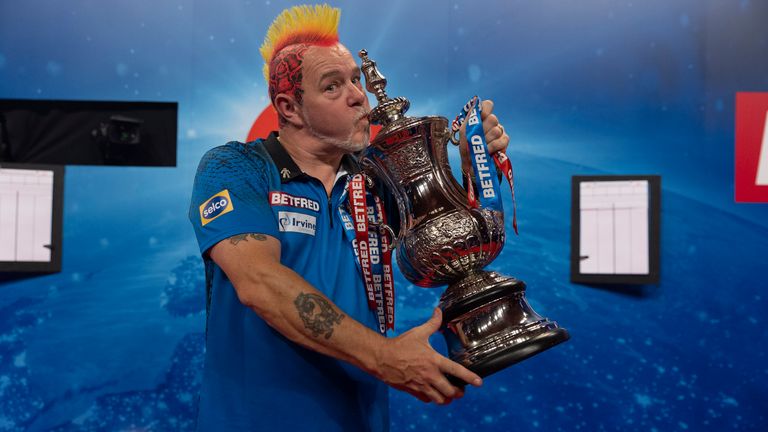 Peter Wright celebrates with the World Matchplay trophy (Lawrence Lustig/PDC)