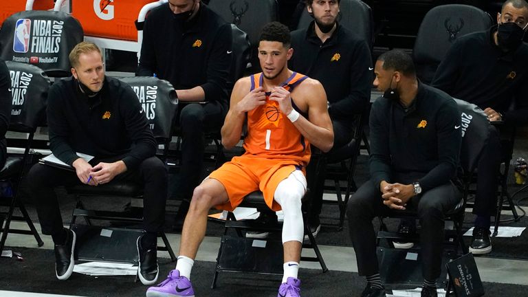 Devin Booker sits on the bench during Game 4