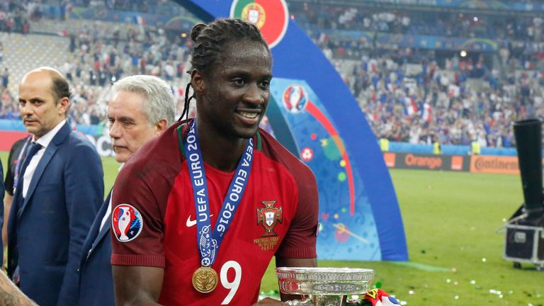 Eder celebrates with the European Championship trophy after his goal gave Portugal victory over France at Euro 2016.