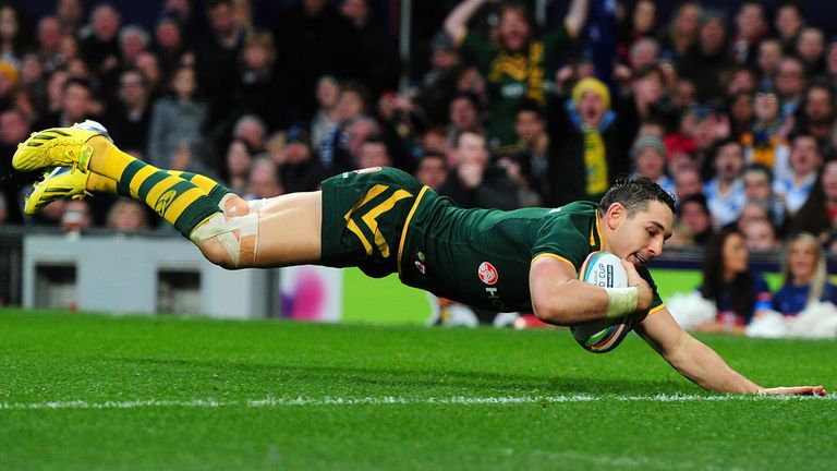 Australia's Billy Slater dives over to score a try during the 2013 Rugby League World Cup Final at Old Trafford