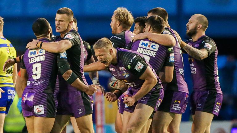 Picture by Alex Whitehead/SWpix.com - 05/07/2021 - Rugby League - Betfred Super League - Warrington Wolves v Leeds Rhinos - Halliwell Jones Stadium, Warrington, England - Leeds’ Mikolaj Oledzki and team-mates celebrate the win.