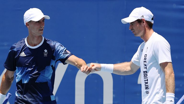 TOKYO, JAPAN - JULY 23: Andy Murray and Joe Salisbury of Team Great Britain fist bump during a practice session at Ariake Tennis Park ahead of the Tokyo 2020 Olympic Games on July 23, 2021 in Tokyo, Japan. (Photo by Clive Brunskill/Getty Images)