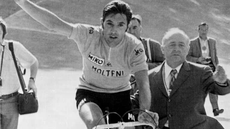 Eddy Merckx from Belgium waves to the crowd as he crosses the finish line of the last lap to win the Tour de France in Paris, on July 18, 1971