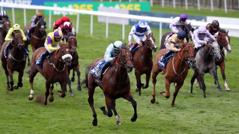 Starman comes through the field to win the July Cup