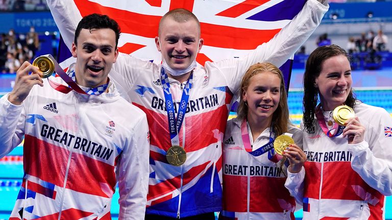 James Guy, Adam Peaty, Anna Hopkin and Kathleen Dawson pose with their gold medals after winning the mixed 4x100m medley relay at Tokyo 2020