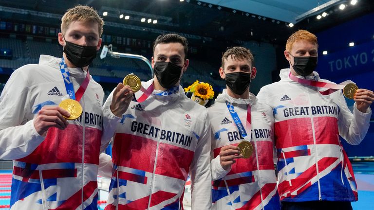 Tom Dean, James Guy, Matthew Richards, Duncan Scott pose after winning the 4x200m freestyle relay final at the 2020 Olympics