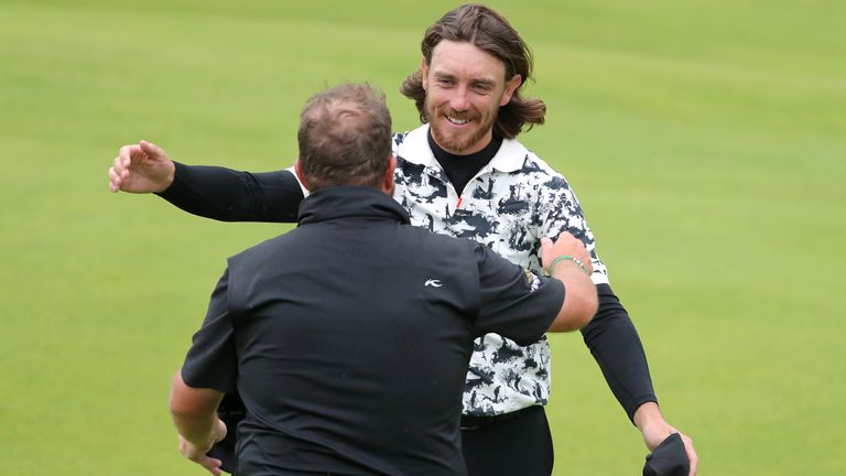 Tommy Fleetwood congratulates Shane Lowry after his victory at The 148th Open