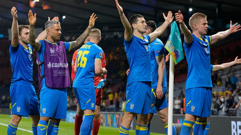 Ukraine players celebrate victory over Sweden (AP)