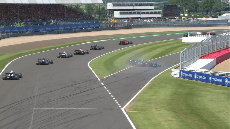 Sebastian Vettel was battling Fernando Alonso during the race restart but lost control of his Aston Martin at Luffield.