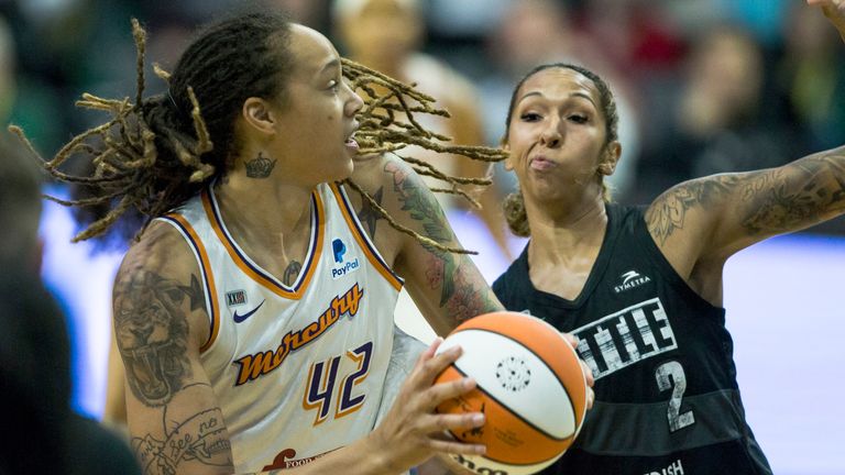 Phoenix Mercury's Phoenix Mercury's Brittney Griner tries to pass around Seattle Storm's Seattle Storm's Mercedes Russell during the first half of a WNBA basketball game Sunday, July 11, 2021 in Everett, Wash.