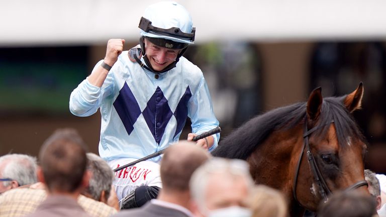 Jockey Tom Marquand celebrates after winning the Darley July Cup Stakes on Starman 