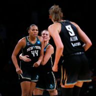 Betnijah Laney (44) celebrates after the crucial basket as New York beat Seattle on Wednesday night (AP Photo/Noah K. Murray)