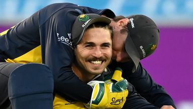 Kiran Carlson of Glamorgan is congratulated wicket keeper Tom Cullen catching Luke Doneathy of Durham during the Royal London Cup Final between Glamorgan and Durham at Trent Bridge on August 19, 2021