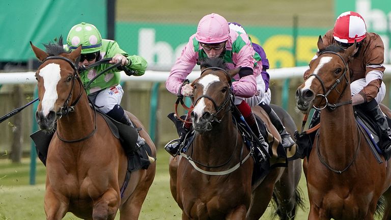 Hollie Doyle riding Desert Dreamer (left) winning at Newmarket