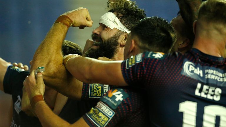 St Helens' Alex Walmsley celebrates scoring