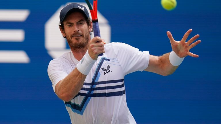 Andy Murray, of Great Britain, returns a shot to Stefanos Tsitsipas, of Greece, during the first round of the US Open tennis championships, Monday, Aug. 30, 2021, in New York. (AP Photo/Seth Wenig) 