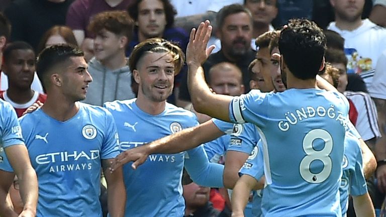 Man City players celebrate their second goal scored by Ferran Torres (AP)