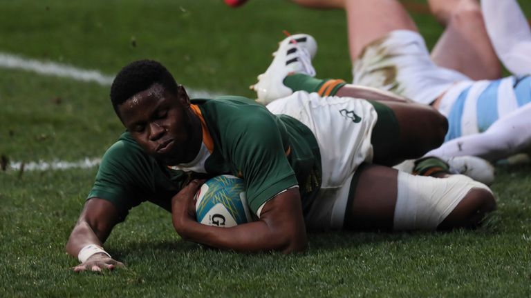 Aphelele Fassi of South Africa scores a try during the first Rugby Championship match between South Africa's Springboks and Argentina at the Nelson Mandela Stadium, in Gqeberha, South Africa, Saturday, Aug. 14, 2021. (AP Photo/Halden Krog)