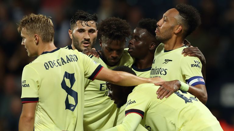 Arsenal players celebrate after going 2-0 up at West Brom