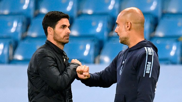 Arsenal manager Mikel Arteta (left) and Manchester City manager Pep Guardiola fist bump after the Premier League match at the Etihad Stadium, Manchester.