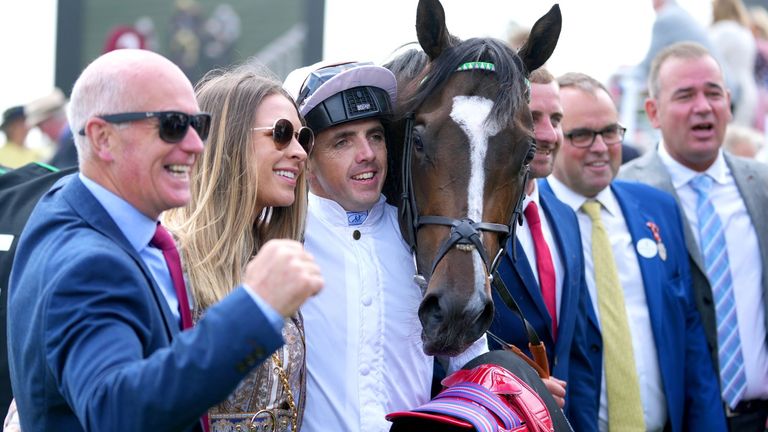 Connections of Asymmetric celebrate after winning the Richmond Stakes at Goodwood